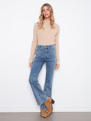 Denim jeans with a stylish flare leg, featuring a heart embroidery design for a playful touch. Crafted for comfort by Charlie B.