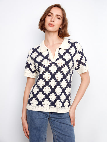 Chic crochet top in navy and cream, featuring short sleeves and a standout geometric pattern by Charlie B.