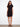 Elegant black dress with a crew neckline and short sleeves, featuring knee-length design by Charlie B.