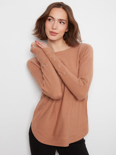 Sweater featuring a classic boat neck, adding elegance and style to any outfit. Perfect for casual or dressy occasions. By Charlie B.