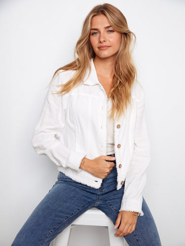 White jacket with handy front pockets, ideal for keeping essentials close. Complements any wardrobe seamlessly by Charlie B.
