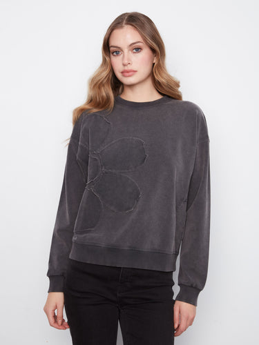 Charcoal top featuring drop shoulders and floral applique, crafted from stretch cotton by Charlie B.