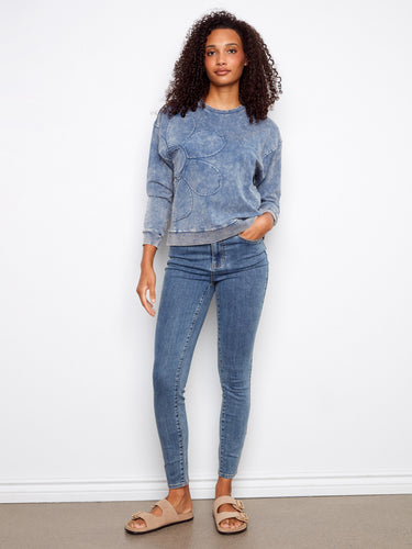 Featuring drop shoulders, this blue sweatshirt combines comfort and style effortlessly for everyday fashion by Charlie B.