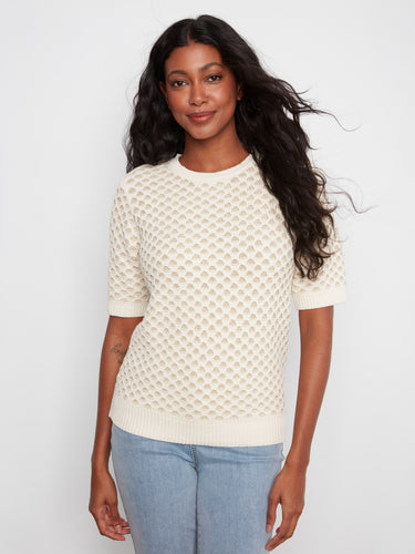 This stylish top features a crew neck design, perfect for casual outings or layering with your favorite jacket. By Charlie B.