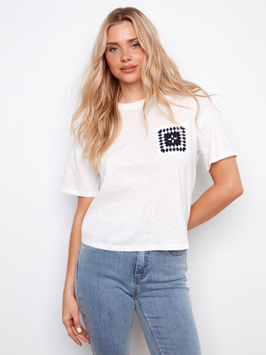 White organic cotton t-shirt with crochet pocket detail, perfect for casual wear. Made from 100% cotton by Charlie B.