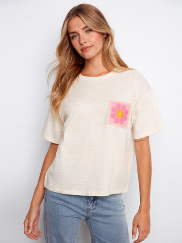 This beige top features a stylish crew neckline, making it a versatile piece for any wardrobe. Crafted by Charlie B.