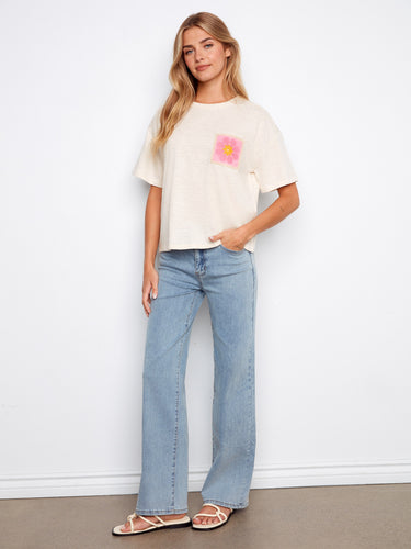 Made from 100% cotton, this top offers comfort and breathability for everyday wear. Designed by Charlie B.