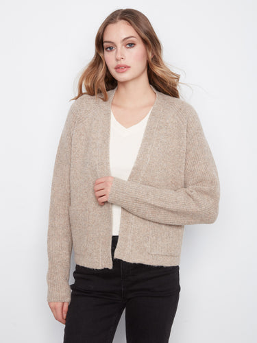 Stylish cardigan featuring raglan sleeves that offer a relaxed fit and modern look, designed by Charlie B.