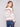 Intricate patchwork detailing adds depth and interest to this versatile knit piece by Charlie B.