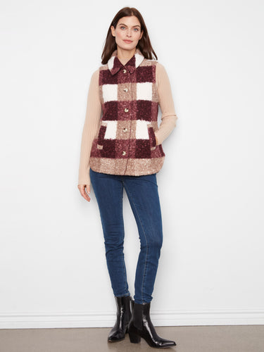 Plaid vest featuring a button-front closure for versatile styling. The cozy texture adds warmth and charm to any outfit. By Charlie B.