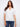 White blouse with blue stripes featuring a stylish notch neckline, crafted from 100% cotton by Charlie B.