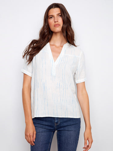 White blouse with blue stripes featuring a stylish notch neckline, crafted from 100% cotton by Charlie B.