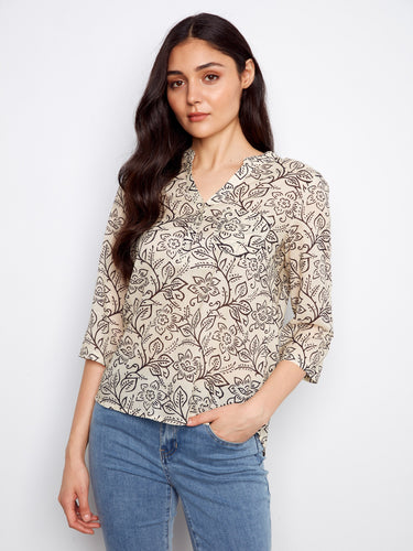 Floral blouse with a stylish chest pocket, perfect for casual outings. Designed by Charlie B.