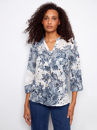 Floral print Henley blouse featuring a chest pocket and adjustable roll-up sleeves, perfect for versatile styling by Charlie B.
