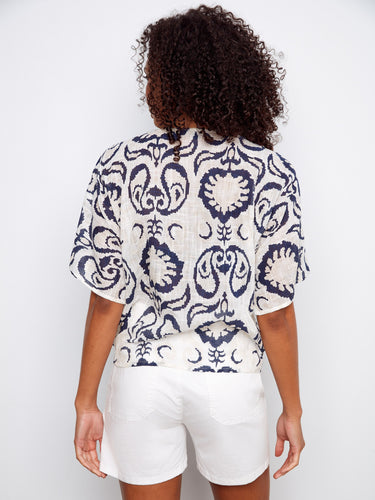 Fashionable garment made from a lightweight cotton blend, offering breathability and style in one versatile piece. By Charlie B.