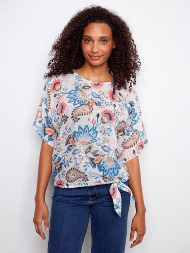 Crafted from a lightweight cotton blend, this floral top ensures breathability and comfort throughout the day by Charlie B.
