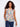 Floral top with a Henley neckline and colorful design, perfect for casual outings. Finished by Charlie B.