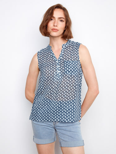 Blouse with a Henley neckline and geometric print, featuring a half-button front for added style by Charlie B.