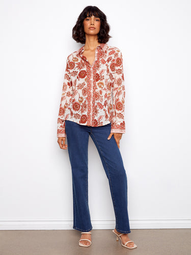 Elegant floral blouse in lightweight cotton, featuring long sleeves for versatile wear by Charlie B.