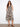 Abstract print dress featuring a V-neck and hidden pockets, perfect for a chic look by Charlie B.