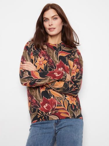 Floral sweater with a crew neckline, showcasing vibrant autumn hues and a comfortable fit. Designed by Charlie B.