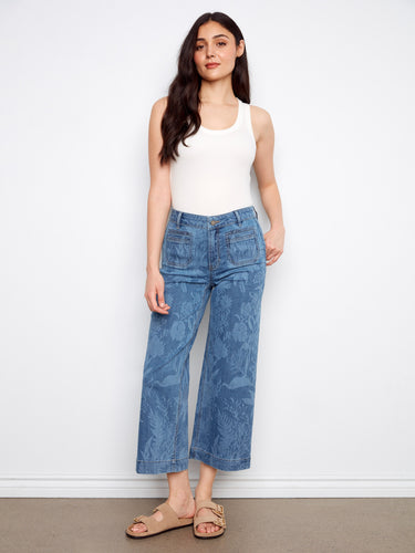 These jeans feature a stylish flare fit, offering a trendy look with floral patterns throughout. Perfect for casual outings by Charlie B.