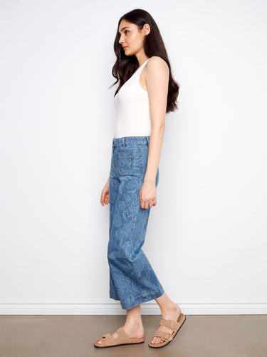 With front patch pockets and back pockets, these jeans provide both style and practicality for carrying essentials by Charlie B.