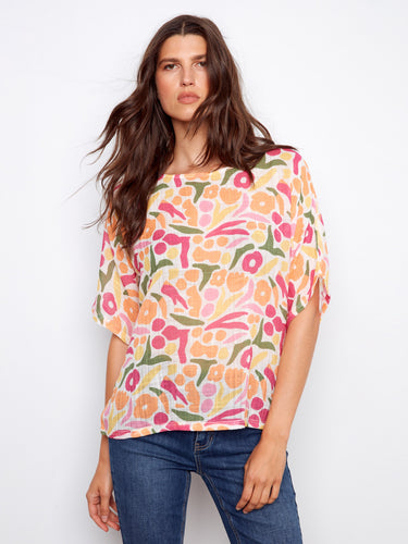 Colorful abstract print blouse with relaxed fit and elbow-length dolman sleeves, made from a lightweight cotton blend by Charlie B.