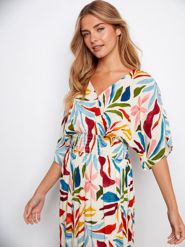 The smocked waist accentuates the silhouette of this lively floral dress, adding comfort and style. Crafted beautifully by Charlie B.