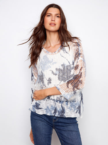 Loose fit fishnet crochet sweater with abstract print, featuring a stylish V-neck by Charlie B.