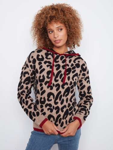 Elevate your look with contrast trims that beautifully frame the bold pattern on this cozy hoodie. By Charlie B.