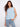 Blue floral top with a crew neckline, perfect for casual outings. The sleeveless design adds a touch of elegance. By Charlie B.