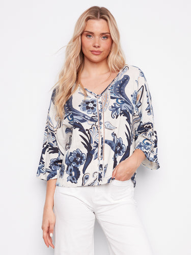 Elegant blouse with a V-neck and wide 3/4 sleeves, showcasing intricate ladder stitch detail by Charlie B.