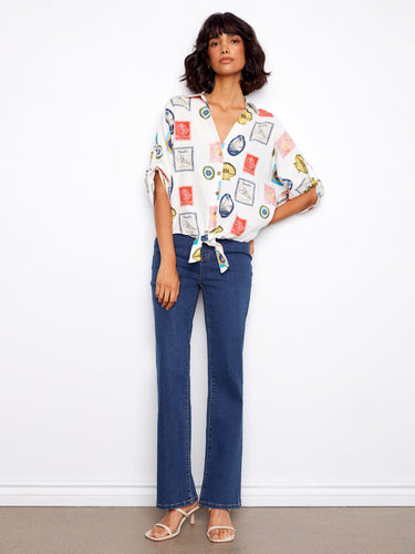 Postcard print blouse with button-up style and charming front tie detail, adding a playful touch by Charlie B.