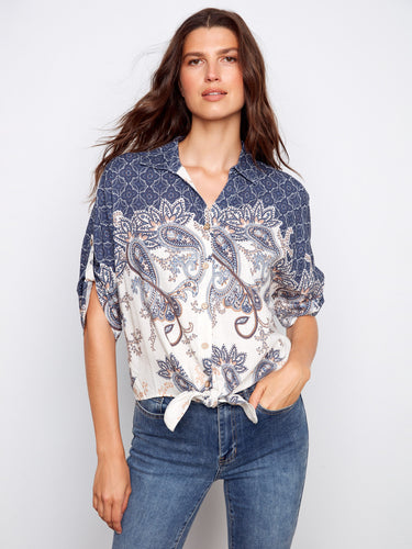 Elegant V-neck blouse with intricate patterns, showcasing its button-up style for a chic look by Charlie B.