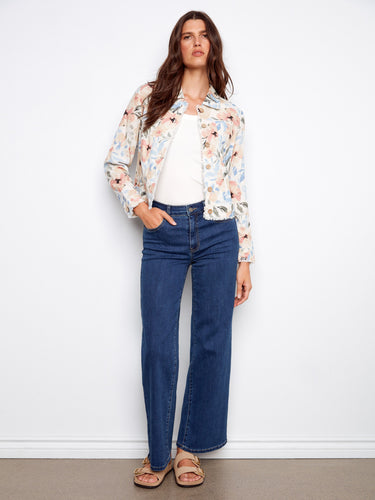 This floral jacket boasts frayed edges, adding a touch of charm to any outfit. Ideal for layering in spring. By Charlie B.