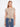 Chic beige blouse with a boat neckline and a stylish front hem tie, perfect for casual outings by Charlie B.