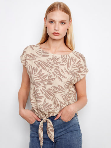 Stylish beige blouse with an eye-catching print and comfortable cap sleeves for relaxed elegance by Charlie B.
