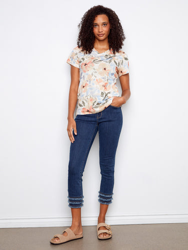 This relaxed fit floral top pairs effortlessly with jeans, offering a chic yet laid-back look by Charlie B.