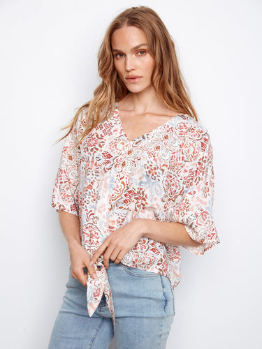 Chic popover blouse featuring short dolman sleeves and a unique front-tie design by Charlie B.