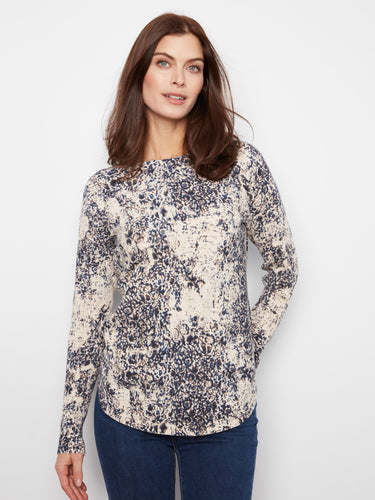 Elegant top with a boat neckline, featuring a unique pattern that adds sophistication to any outfit by Charlie B.