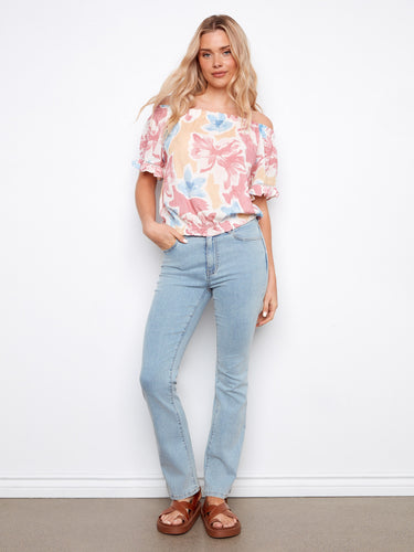 Stylish top with elastic hem, ensuring comfort and fit for all-day wear by Charlie B.