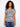 Patterned blouse featuring a V neckline, crafted from a soft linen blend for comfort and style. By Charlie B.
