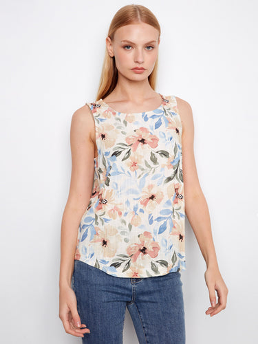 Floral sleeveless top with a scoop neckline, perfect for warm days. The design features a rounded hem for added style by Charlie B.