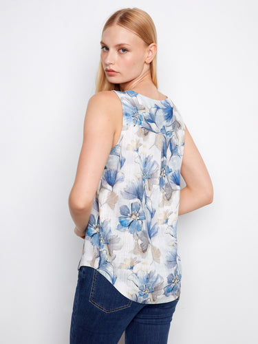 Floral top featuring a rounded hem, adding a subtle flair to the design. Great for pairing with your favorite denim by Charlie B.