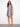 Patterned dress with a crew neckline, showcasing a modern design and elegant style. Perfect for any occasion. By Charlie B.