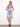 Blue and white dress with a smocked back waist, featuring a floral print and tiered skirt by Charlie B.