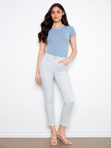 These jeans feature a slim fit design, offering a sleek and modern silhouette. Crafted with precision by Charlie B.