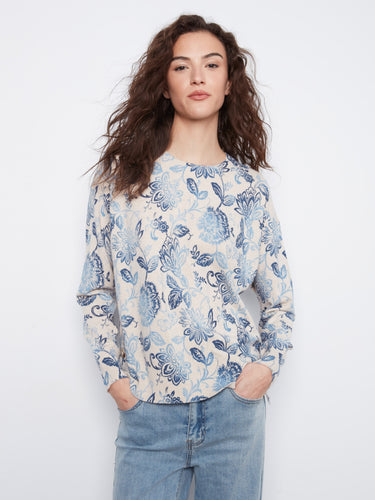 Floral top with a classic crew neck, showcasing an elegant design perfect for casual outings. By Charlie B.