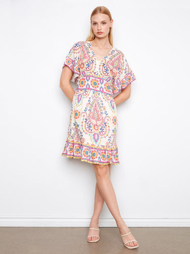 Floral dress featuring a smocked back waist, providing comfort and style with its colorful abstract design by Charlie B.